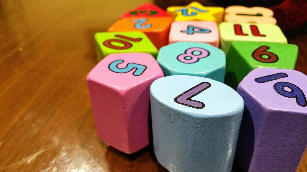 Colourful wooden number blocks on a wooden table